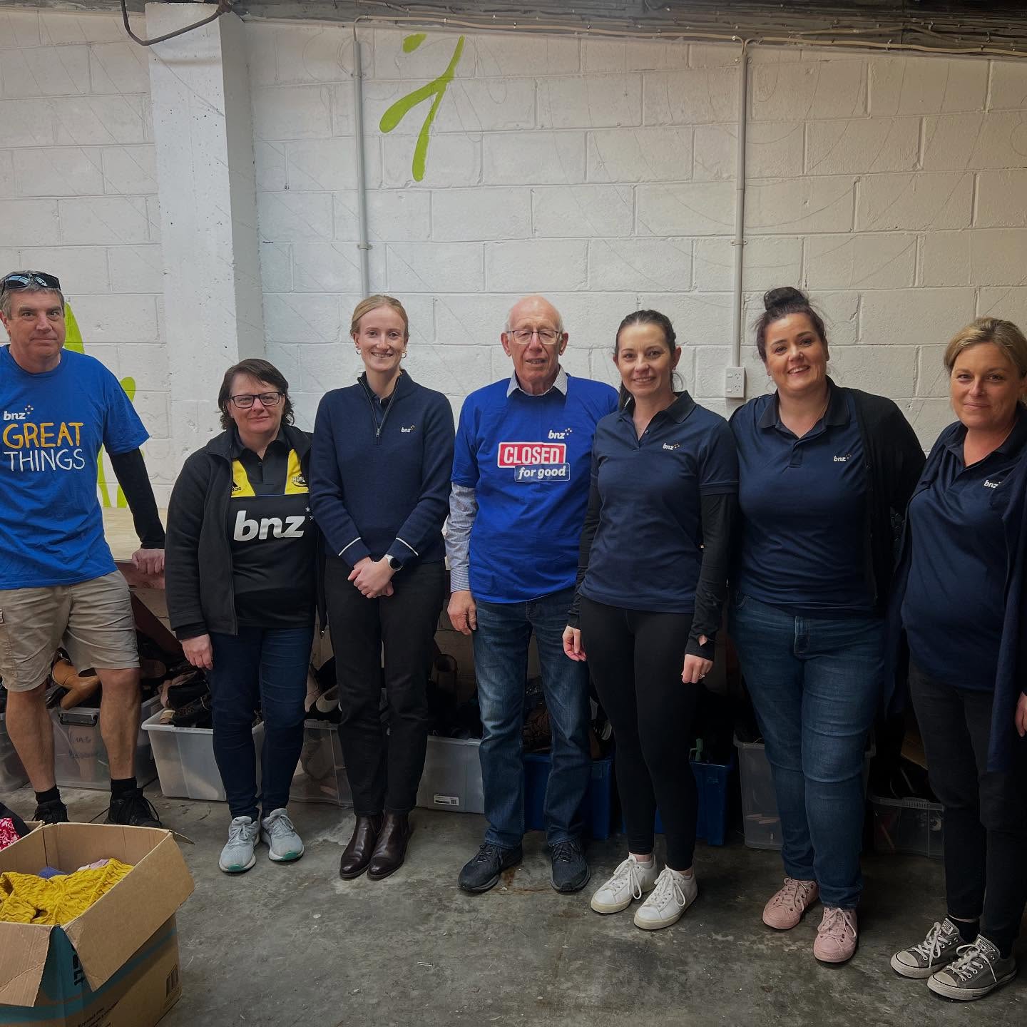 BCC volunteer group in the donation warehouse.